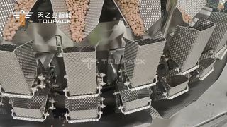 Soluzione per l'imballaggio di alimenti per animali domestici | Pesatrice multitesta a 32 teste + sigillo di riempimento modulo orizzontale